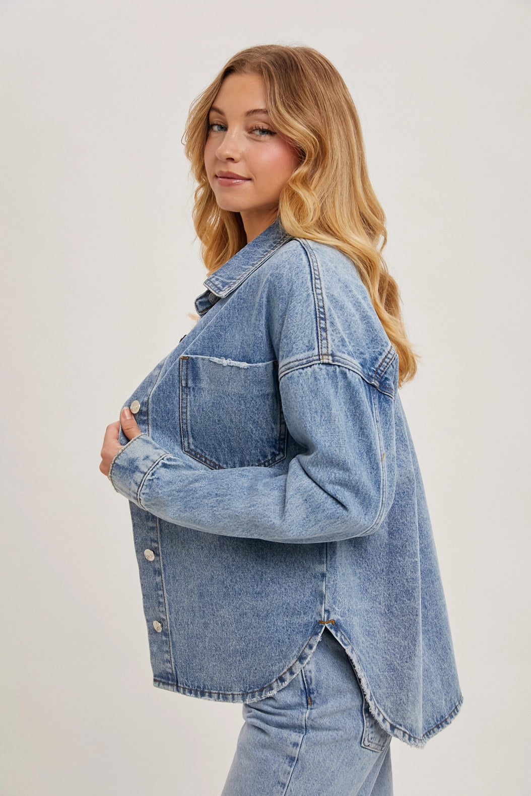 medium washed denim distressed jacket for women