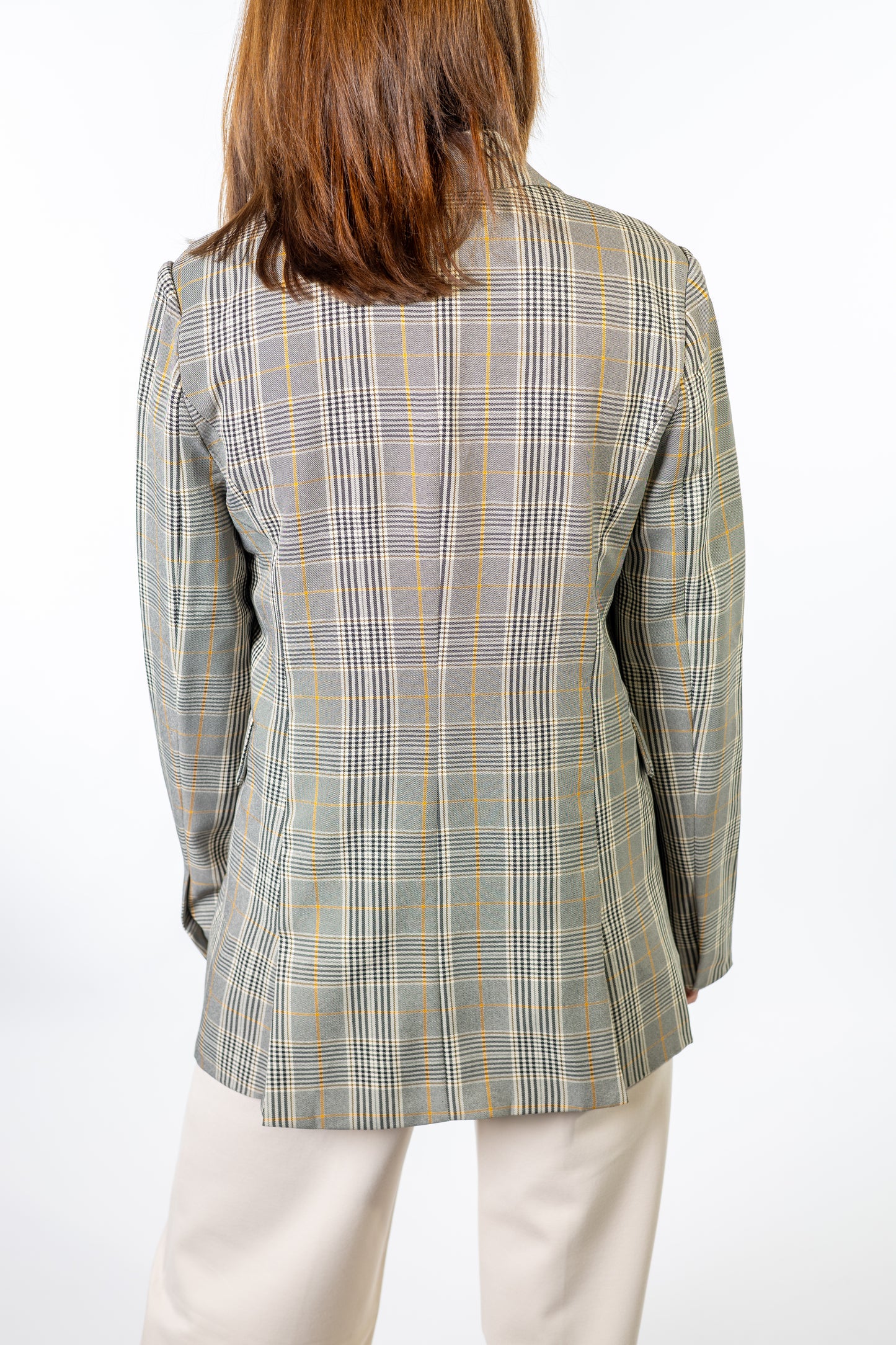 woman wearing plaid blazer