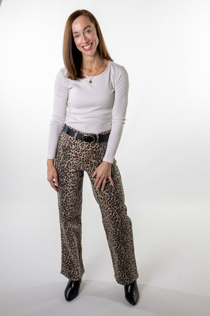 Leopard print jeans outfit idea — bold yet casual animal print jeans pants styled with a cream ribbed top and black belt for an effortless boutique look by Salt & Lavender Clothing.