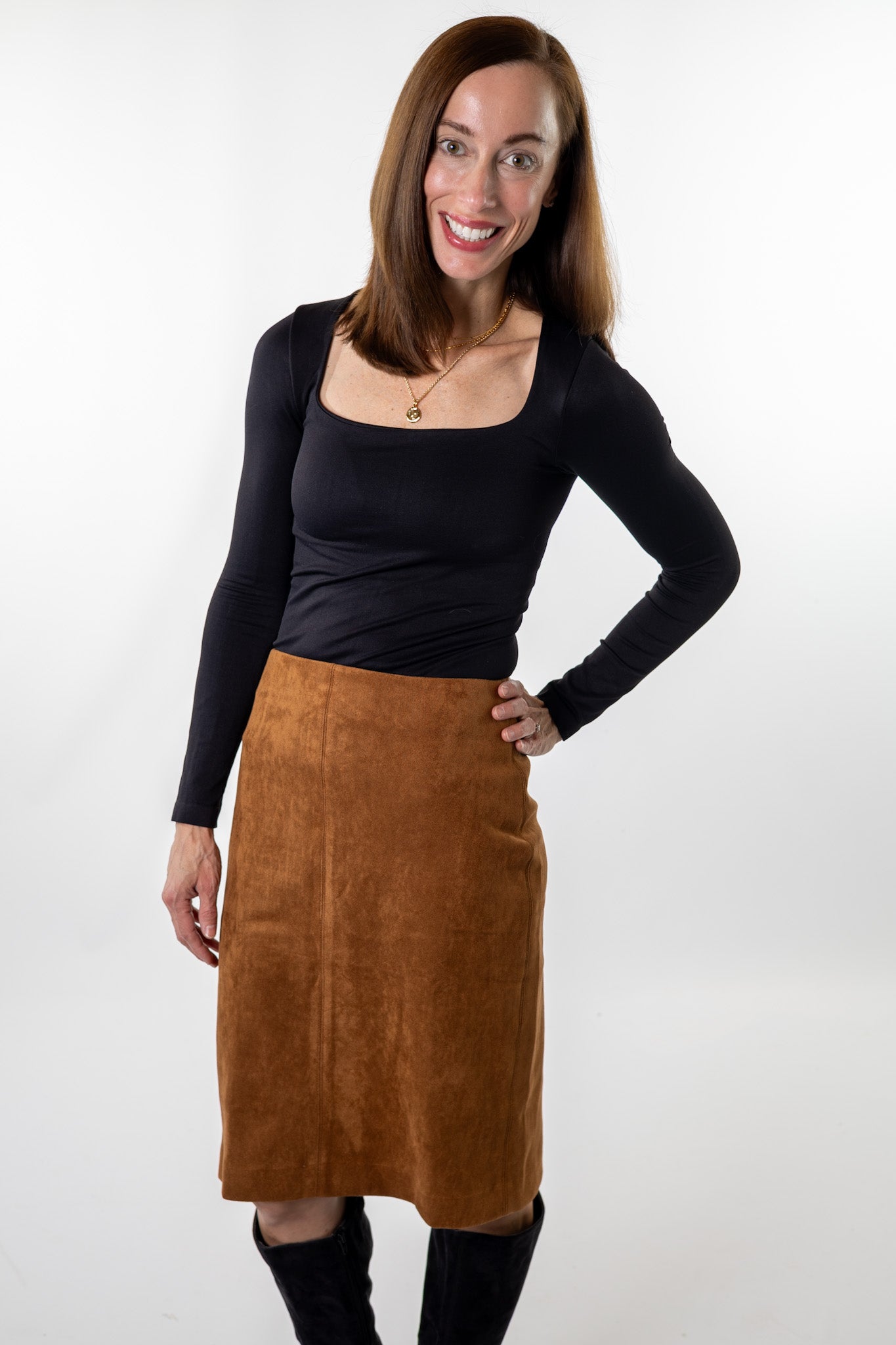 Elegant brown suede skirt styled for fall — timeless and soft midi pencil silhouette paired with a black top and boots from Salt & Lavender Clothing, boutique women’s fashion in Columbus, Ohio.