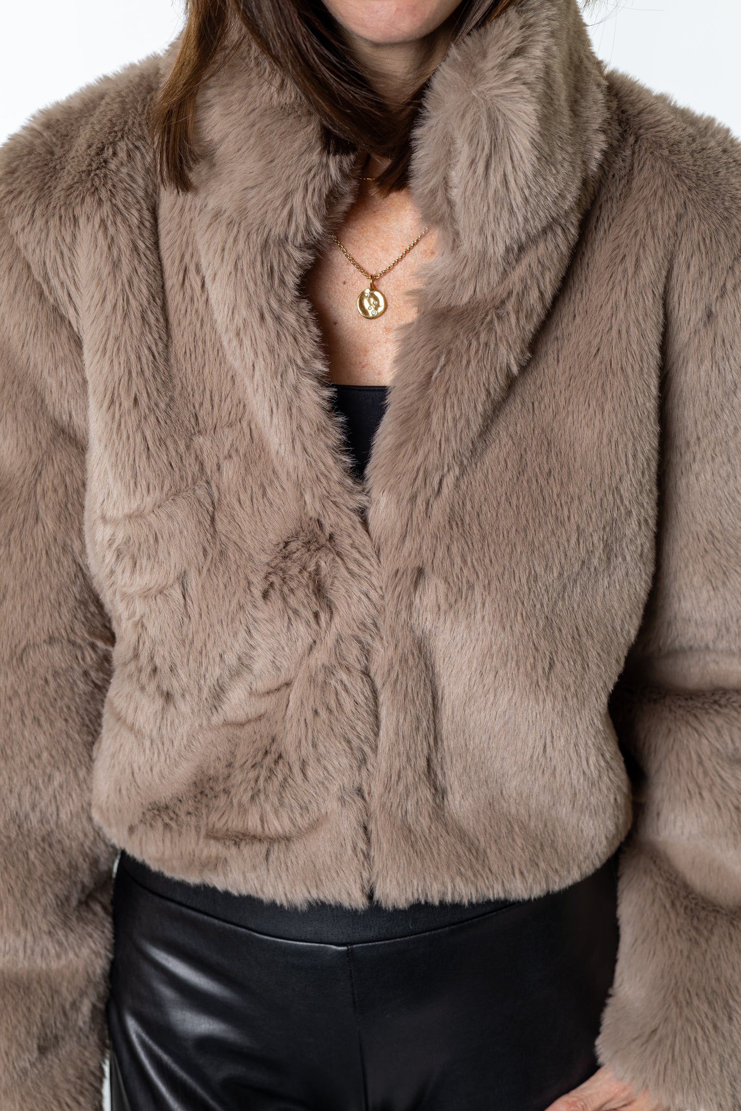 Close-up of Salt & Lavender Clothing’s taupe faux-fur cropped jacket — luxe texture and flattering cropped fit for cozy yet elevated style.
