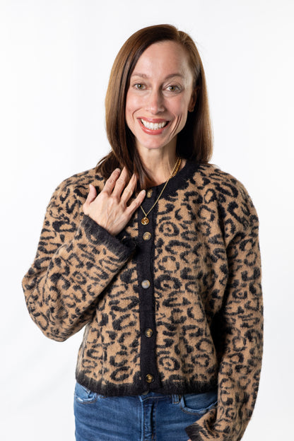 Woman wearing a leopard print sweater cardigan