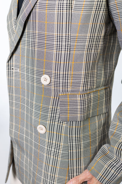 Gray brown yellow plaid suit jacket with a button on a white background