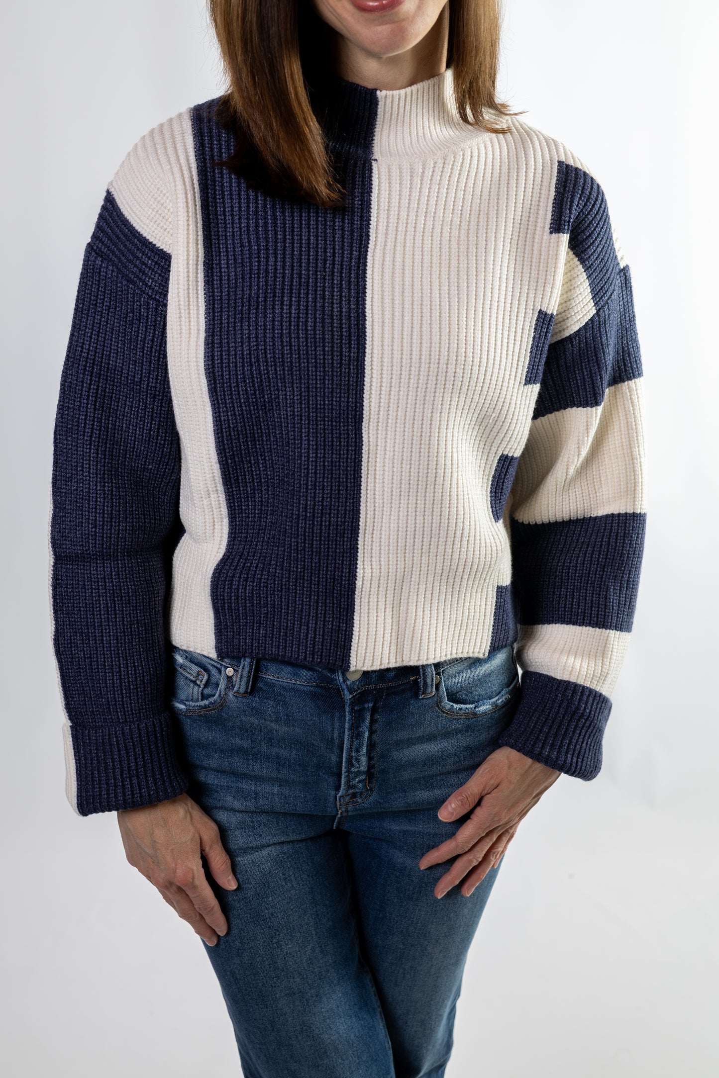 women wearning a blue and white striped sweater with turtleneck