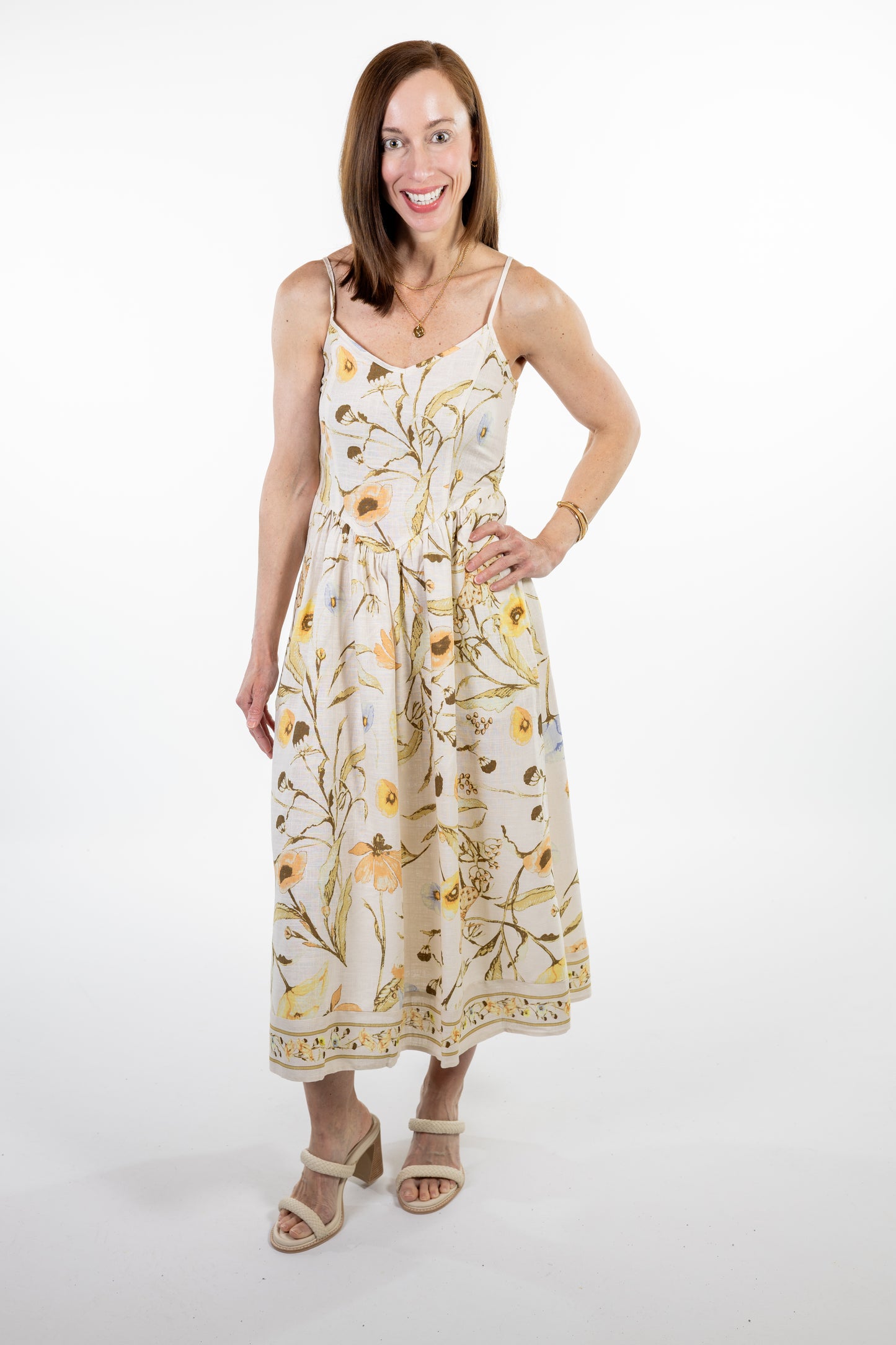 Woman wearing a floral dress on a white background