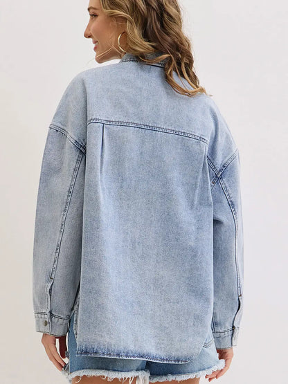Light blue denim jacket worn by a person on a white background